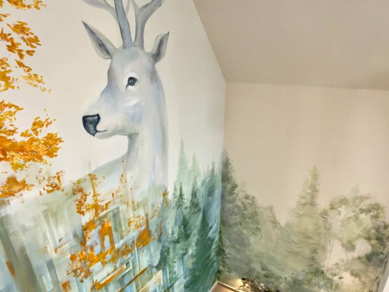 The deer mural on the staircase